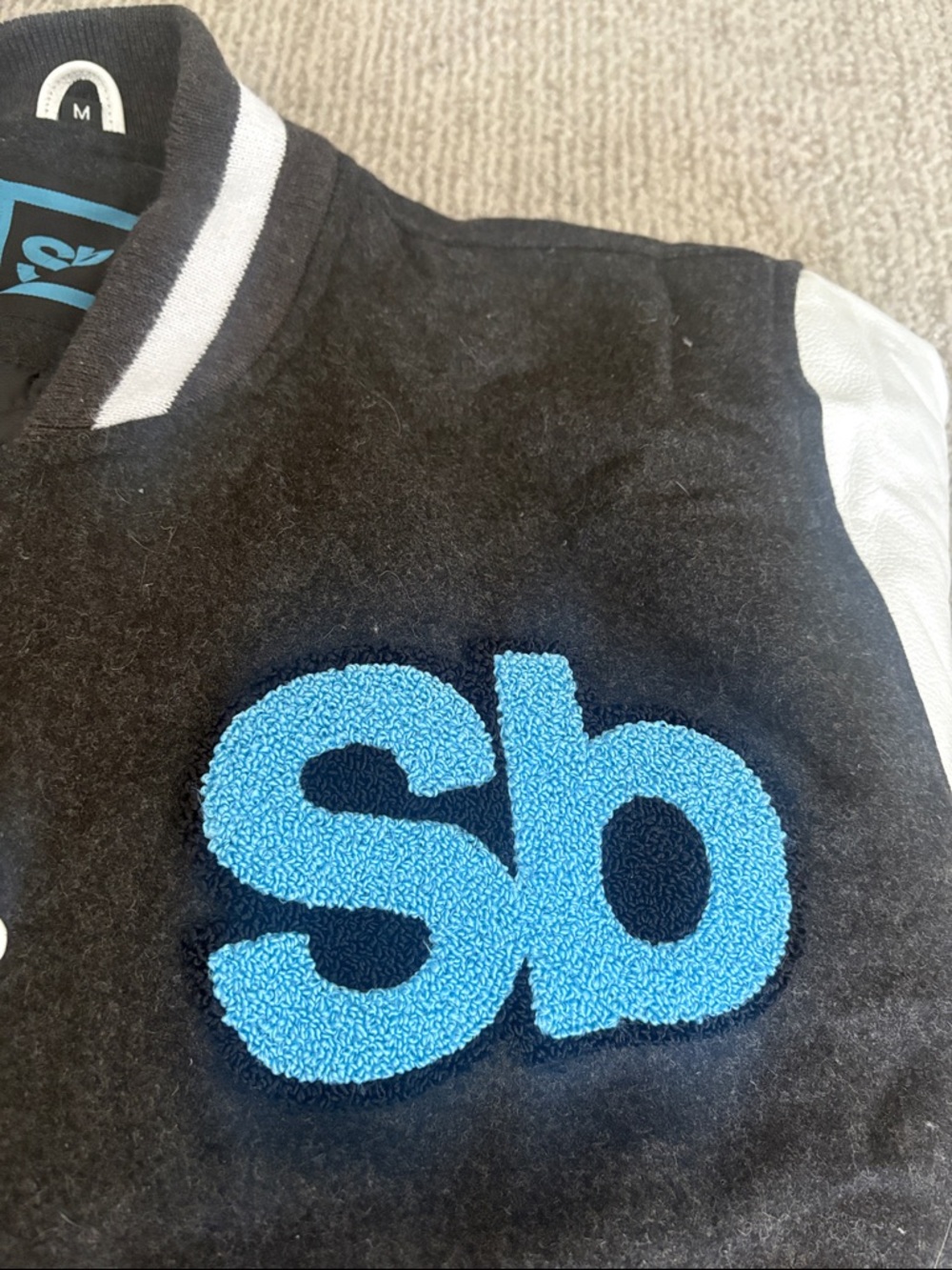 Black and White Varsity Jacket with Blue Appliqué - Picture 12 of 15